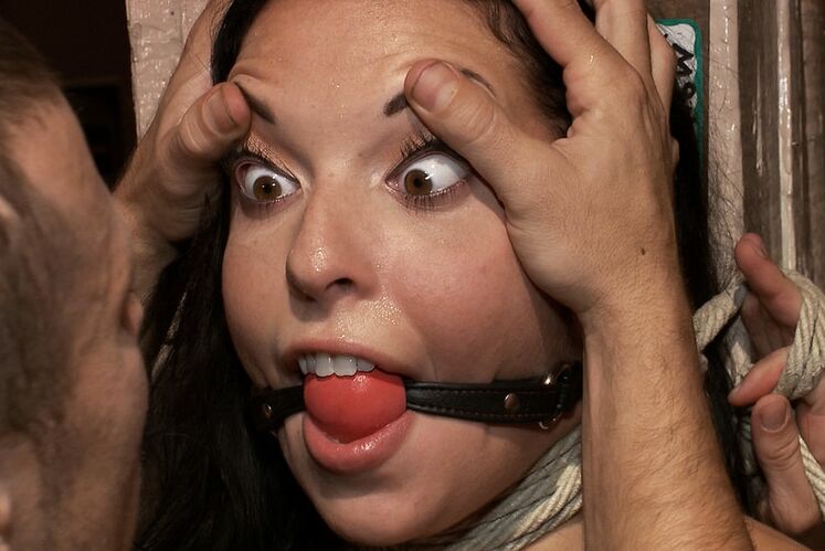 12P Beautiful brunette is tied up and whipped in front of a crowded bar before