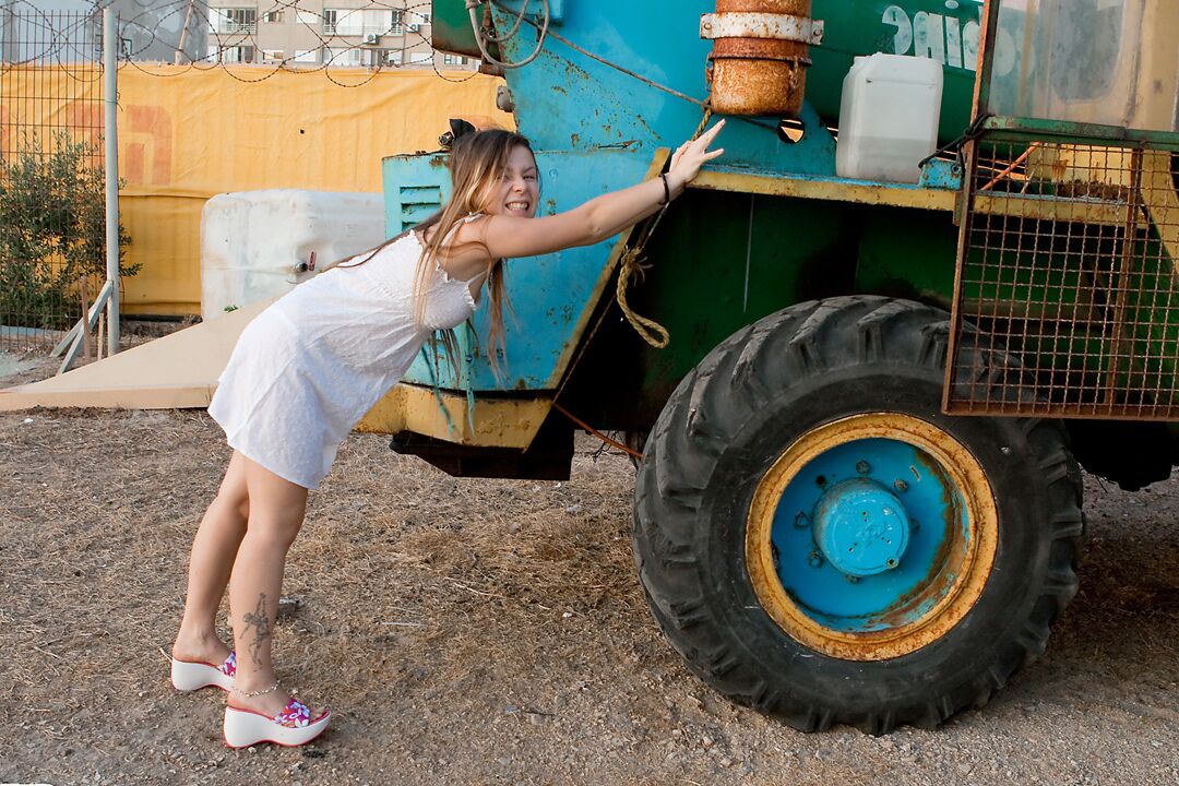15P Cute 18 year old exposes her tiny tits and thong on heavy equipment