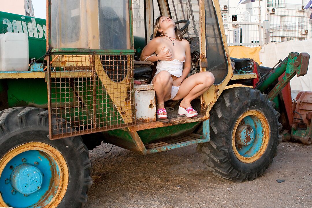 15P Cute 18 year old exposes her tiny tits and thong on heavy equipment
