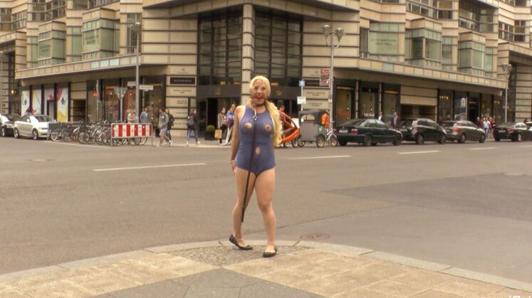 15P Naked blonde slave pees on a public street prior to having sex in public