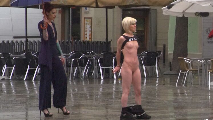 15P Nora Barcelona is humiliated in a rainy Barcelona square before being brought