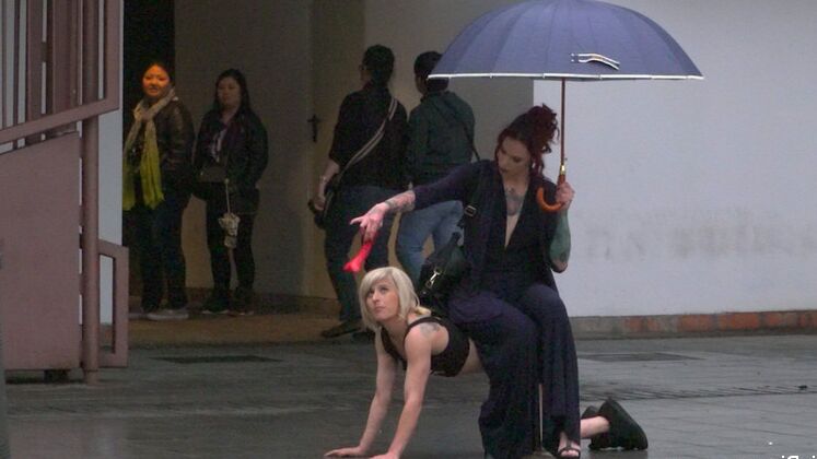 15P Nora Barcelona is humiliated in a rainy Barcelona square before being brought