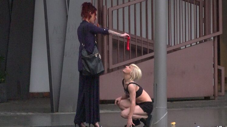 15P Nora Barcelona is humiliated in a rainy Barcelona square before being brought
