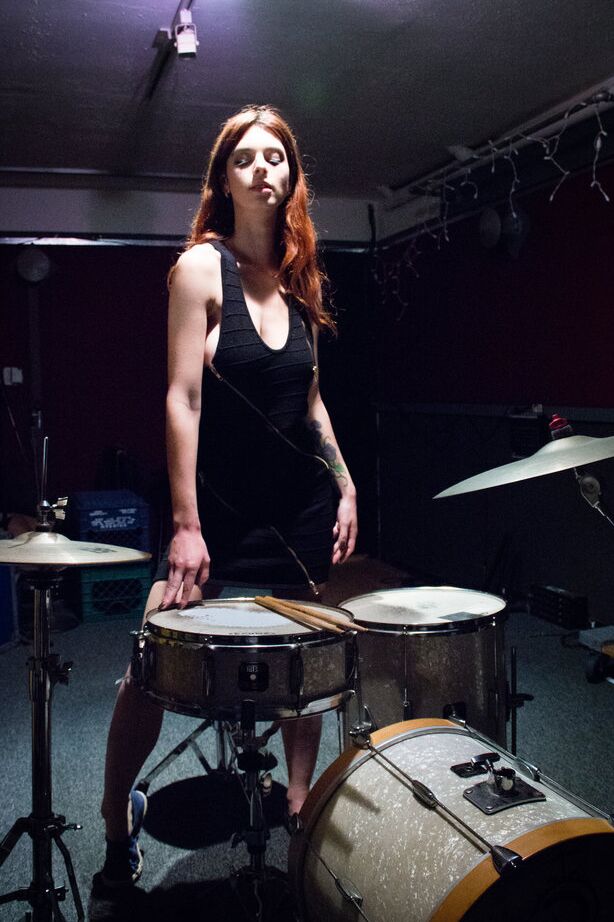 16P Sexy redhead Azura Starr gets naked while sitting at her drum kit