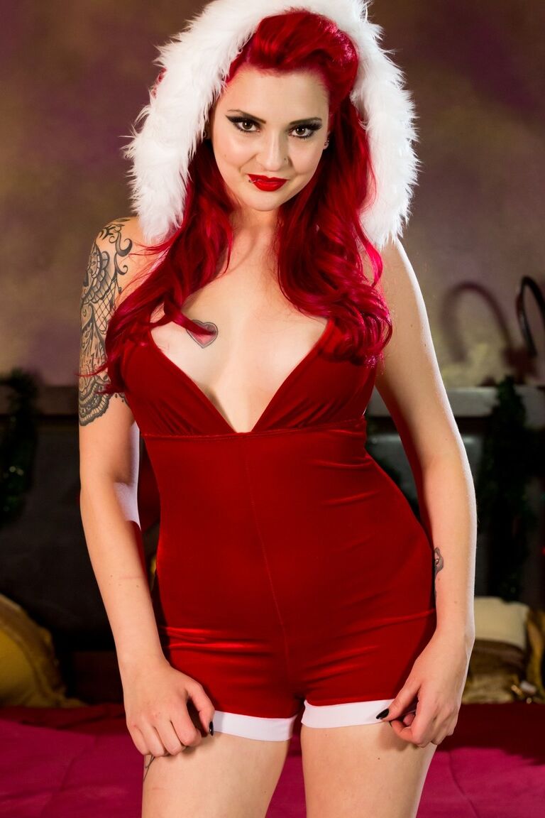 15P Hot redhead with big tits Amber Ivy showing her tattoos after shedding costume