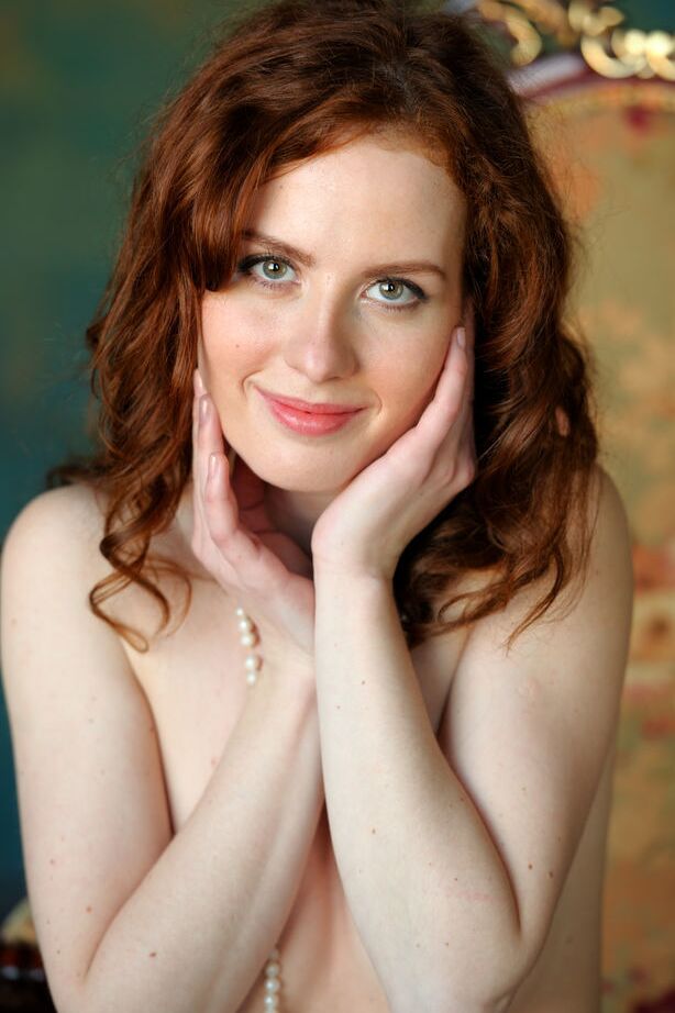 18P Elegant redhead poses in pearls and white stockings to flaunt her hairy muff