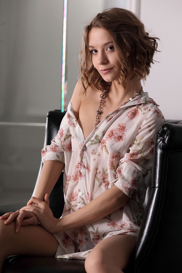 12P Pretty girl casually removes her clothes afore a mirror to model naked