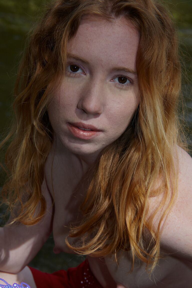 21P Amateur ginger Nicki Blue flashes her hard nipples and tiny tits by the river