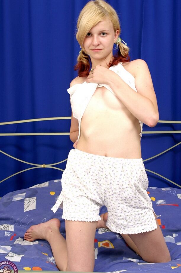 16P Hot young fuckdoll waits for someone to join her in bed while playing with her