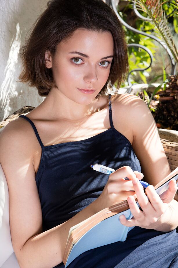 18P Cute brunette Kertu is so intent on writing her deepest thoughts in her diary