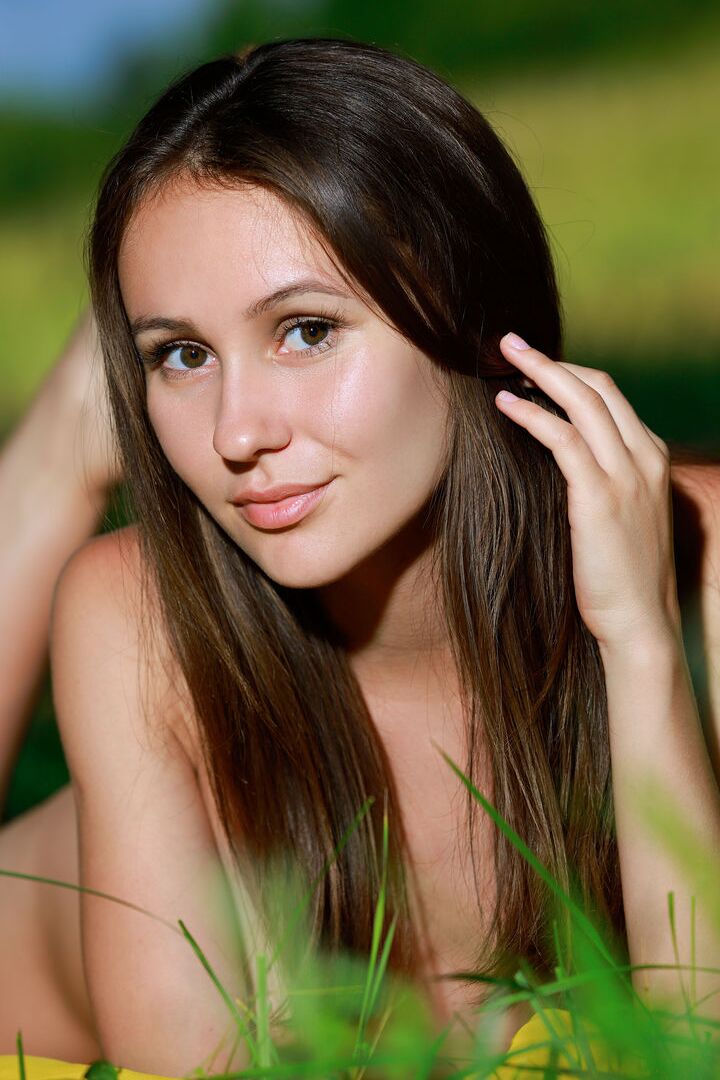 16P Leggy teen Belisa G peels off tight pants to pose nude by trees in a field