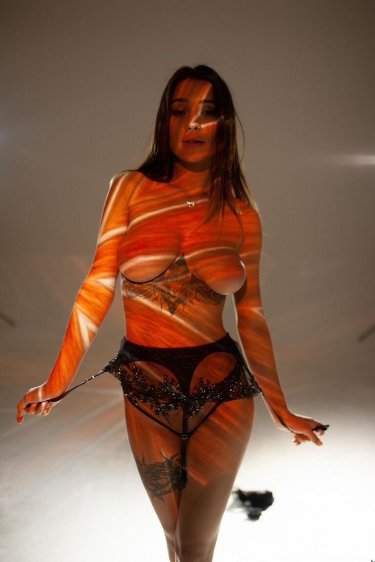 15P Beautiful tattooed Medina poses with natural big tits in psychedelic splendor