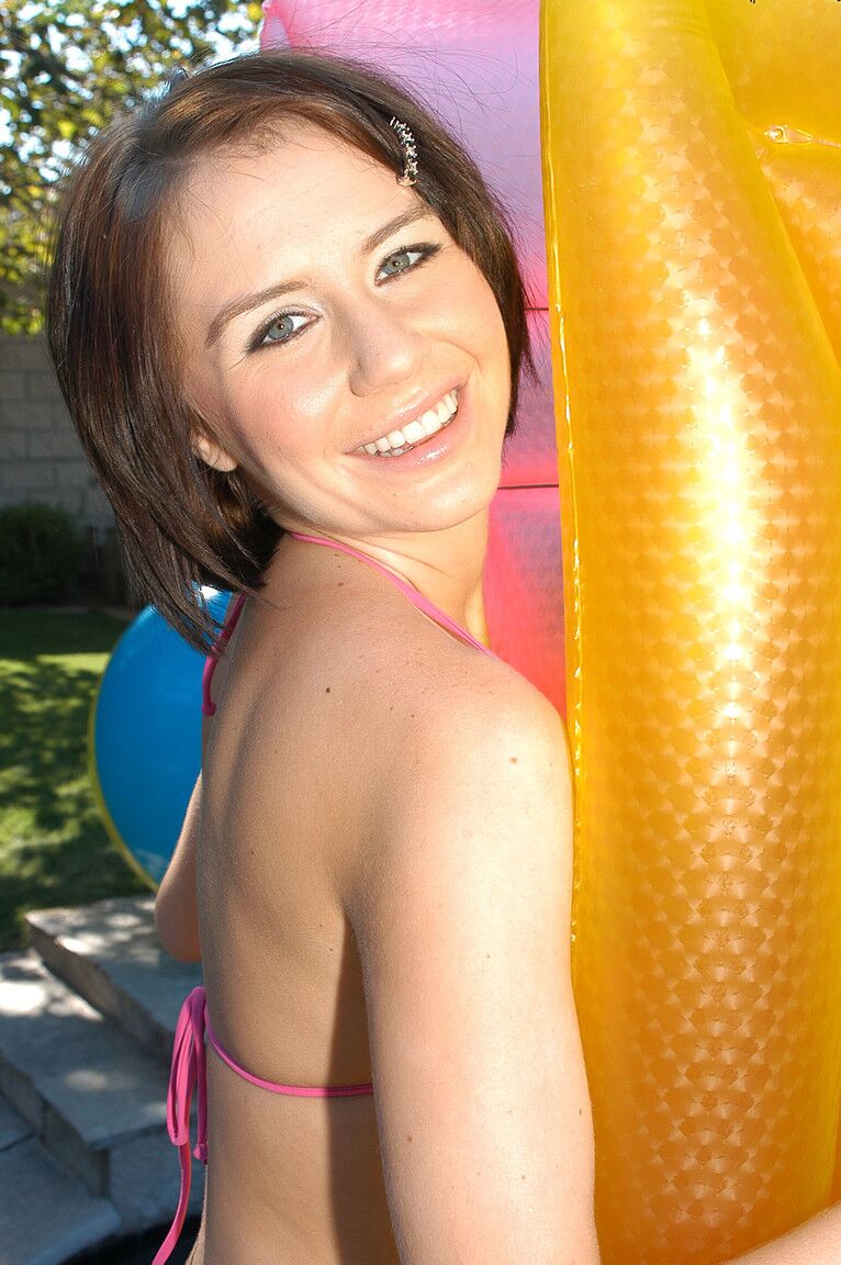 17P Playful teenage cutie in a bikini Kelly Klass rubs her twat by the pool