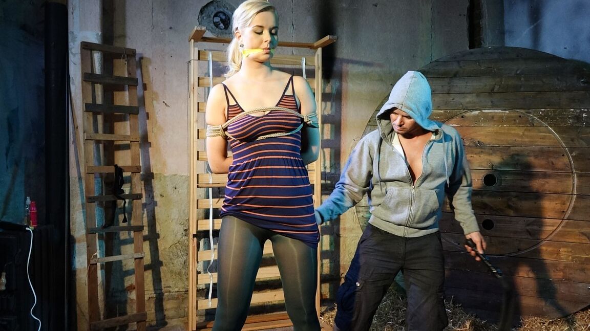 10P Tall female Nikki Dream is gagged and restrained for a fully clothed flogging