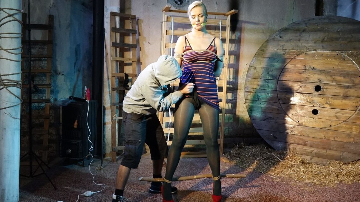 10P Tall female Nikki Dream is gagged and restrained for a fully clothed flogging
