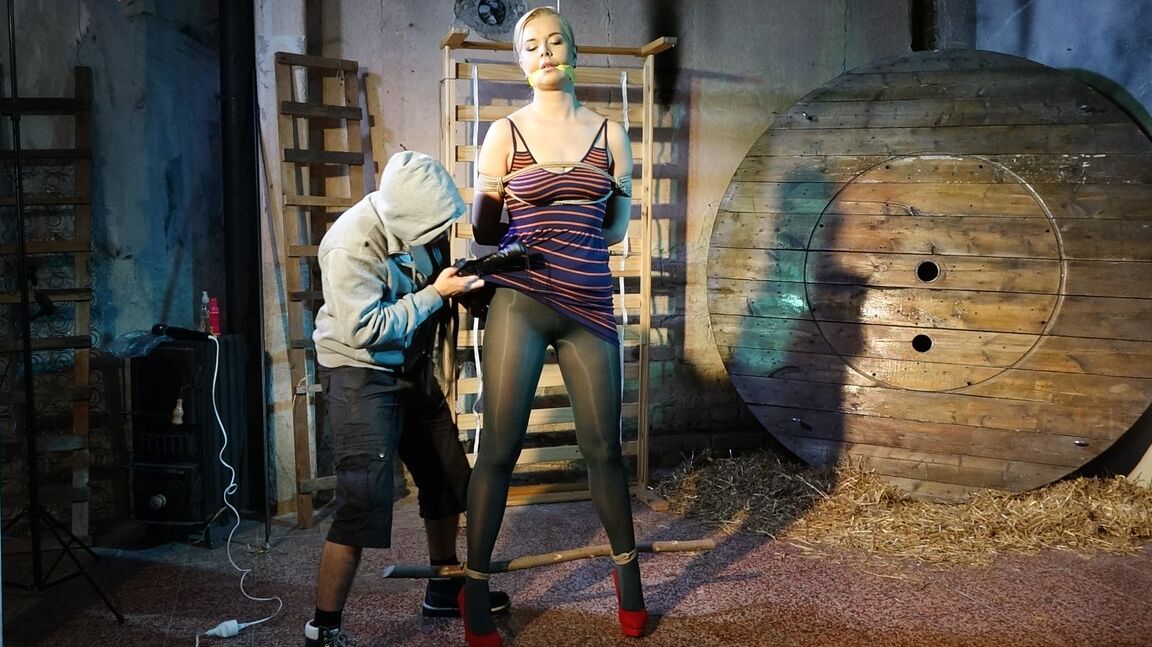 10P Tall female Nikki Dream is gagged and restrained for a fully clothed flogging