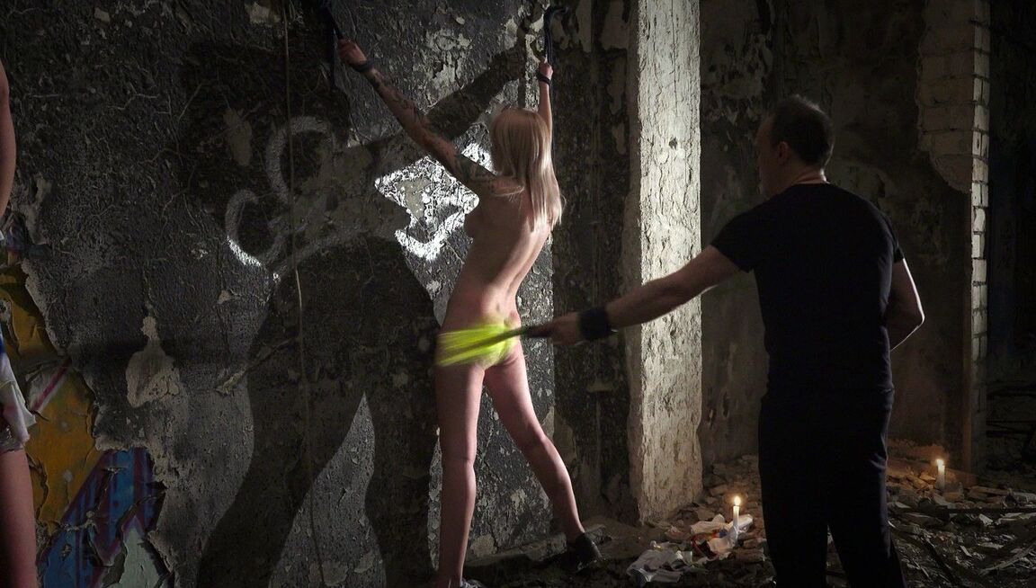 21P Sex slaves giving their BDSM handler a double blowjob after a whipping