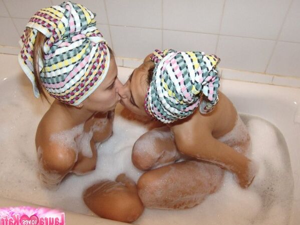 15P Teen lesbians Katrina and Laura wears towels on heads while taking a bath