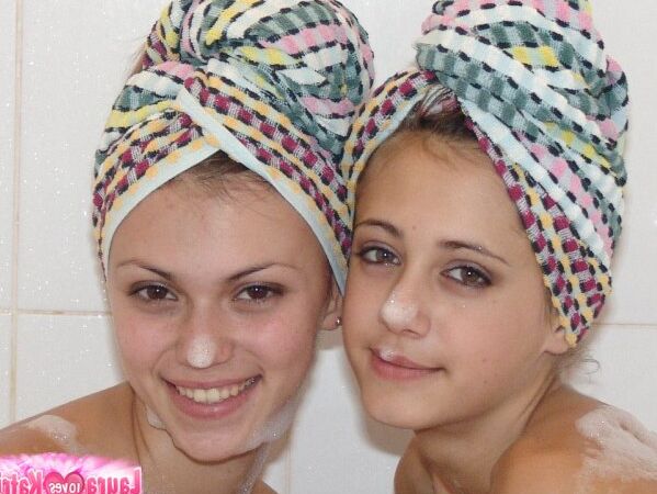 15P Teen lesbians Katrina and Laura wears towels on heads while taking a bath