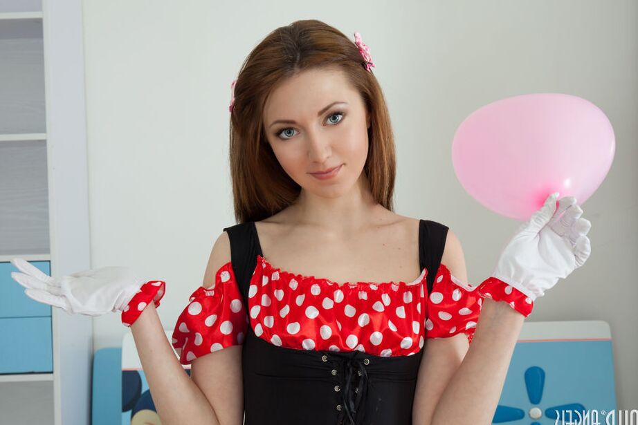 20P Young looking redhead Mini holds a balloon before getting totally naked