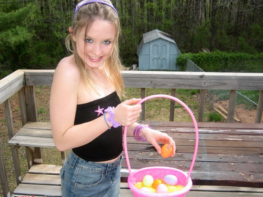 12P Charming young girl exposes a nipple while collecting Easter eggs