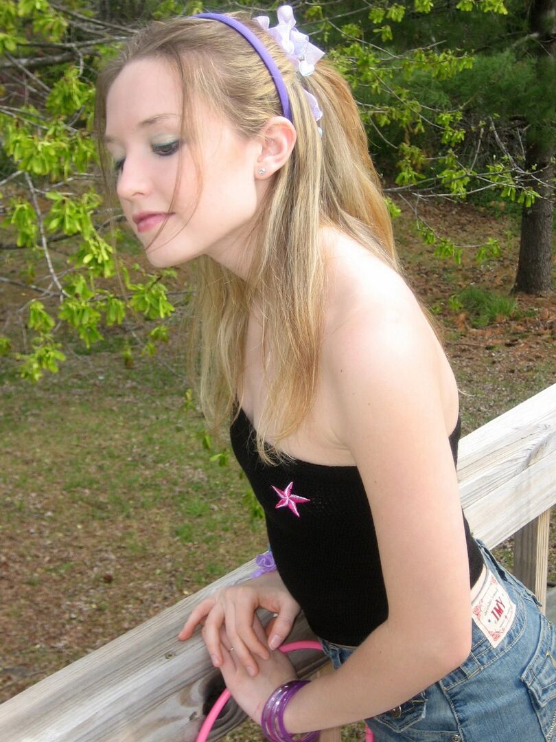 12P Charming young girl exposes a nipple while collecting Easter eggs