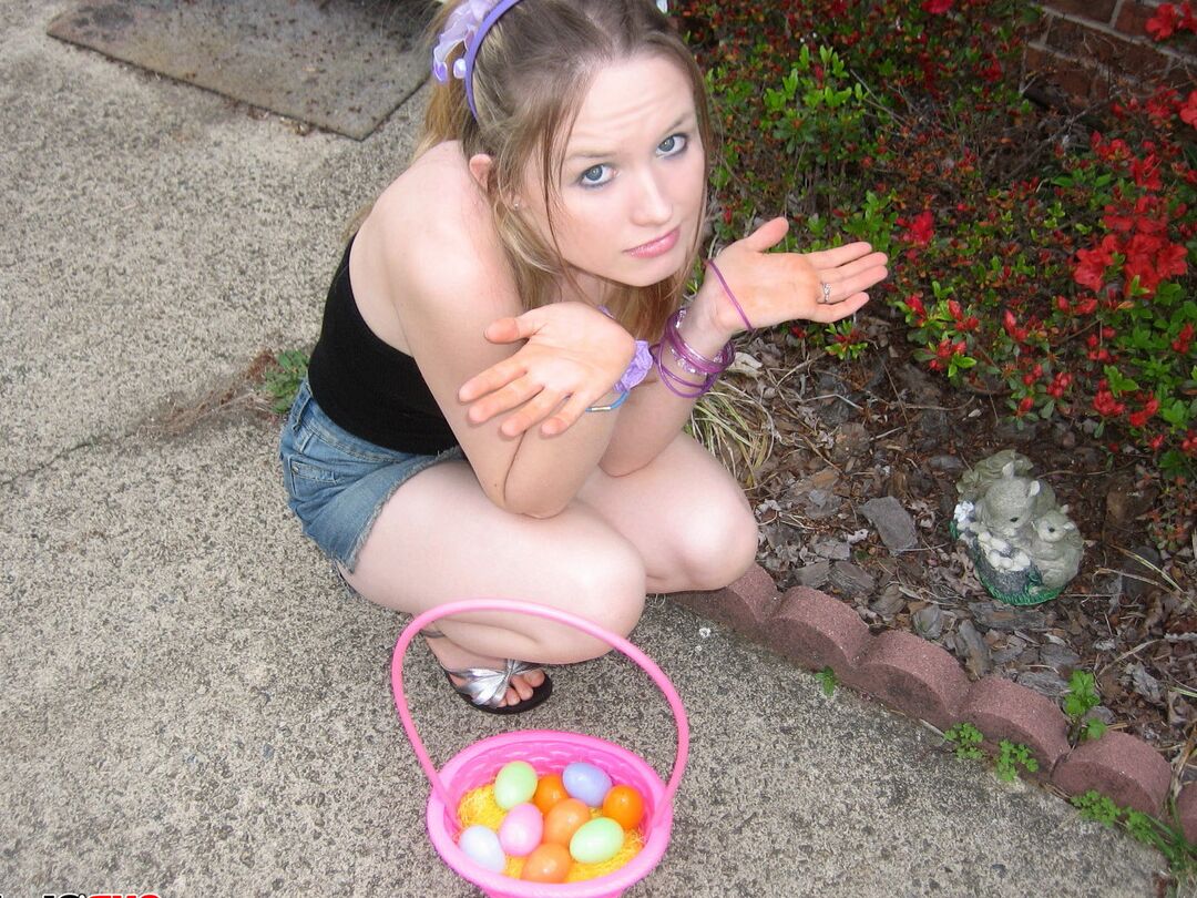12P Charming young girl exposes a nipple while collecting Easter eggs