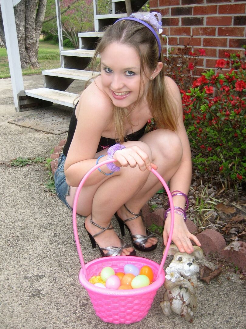 12P Charming young girl exposes a nipple while collecting Easter eggs