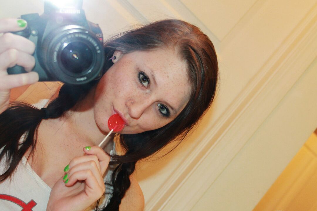 12P Young amateur Freckles 18 takes self shots while getting naked in a mirror