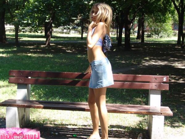 15P Amateur girl partakes in no panty upskirt action in a public park