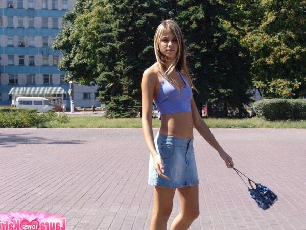 15P Amateur girl partakes in no panty upskirt action in a public park