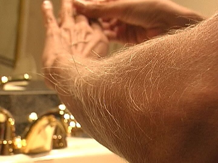 21P MILF Lori Anderson takes care of her hairy arms by applying lotion to them