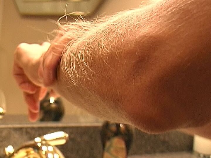21P MILF Lori Anderson takes care of her hairy arms by applying lotion to them