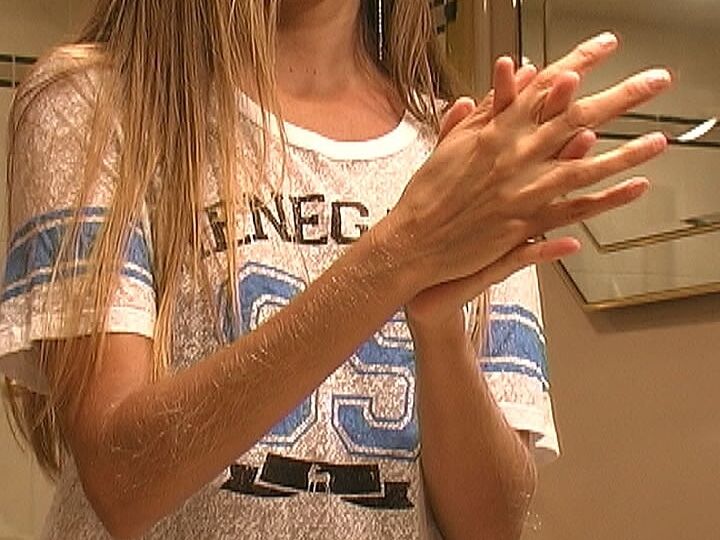 21P MILF Lori Anderson takes care of her hairy arms by applying lotion to them