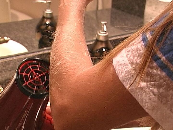 21P MILF Lori Anderson takes care of her hairy arms by applying lotion to them