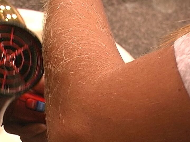 21P MILF Lori Anderson takes care of her hairy arms by applying lotion to them