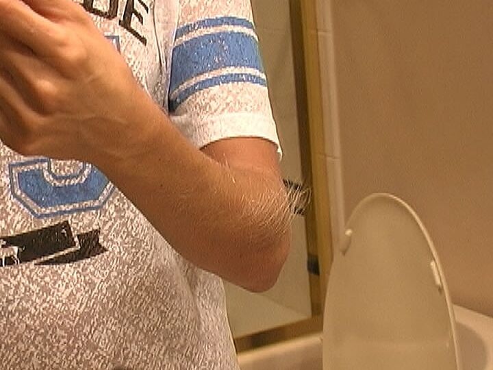 21P MILF Lori Anderson takes care of her hairy arms by applying lotion to them