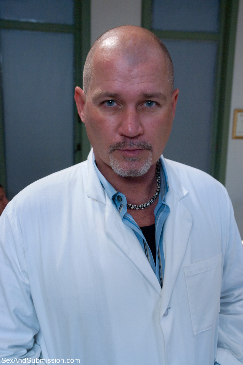 17P Bald doctor examines naked body of good-looking assistant in people's presence