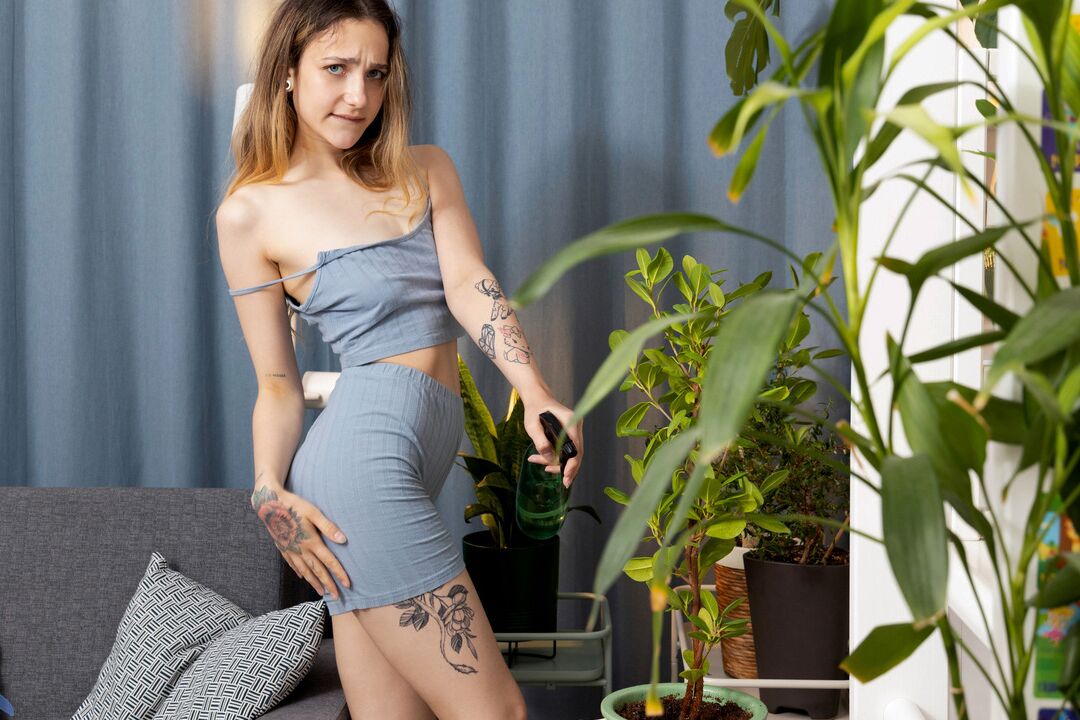 16P Watering her plants makes Ellie Wain keenly aware of how wet and eager her own