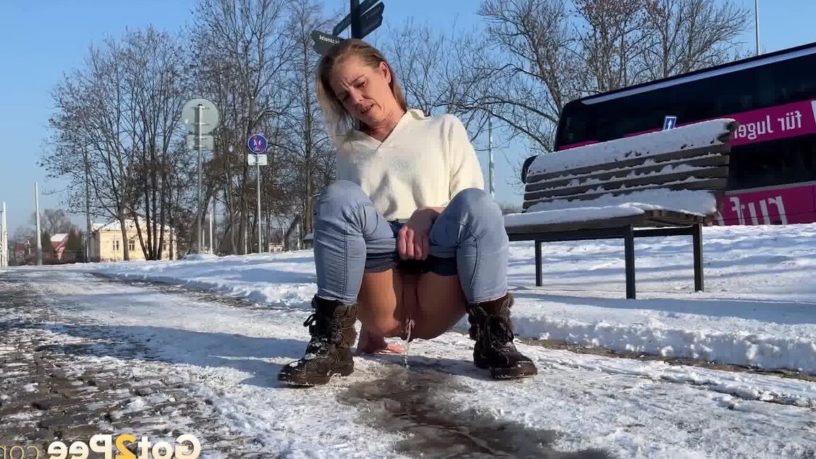 15P Brunette babe squats and melts the ice with piss