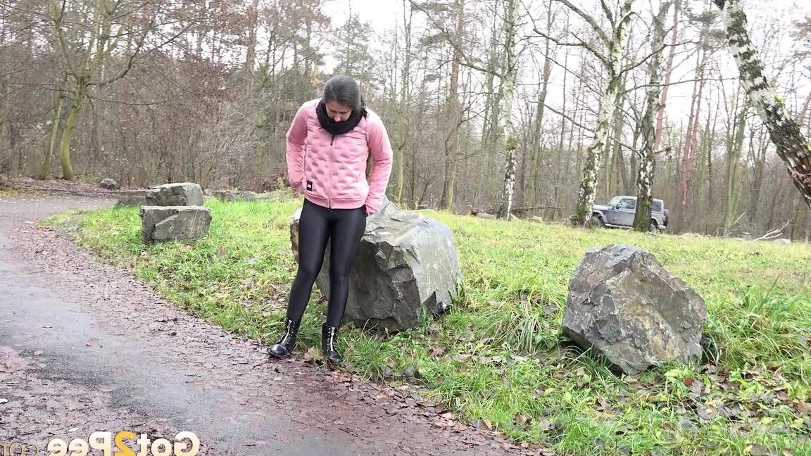 15P Lara Fox squats and pees at the edge of a road