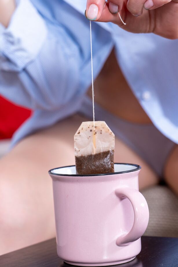 18P Mia Li unbuttons her boyfriend shirt as she sips on a cup of tea and flashes