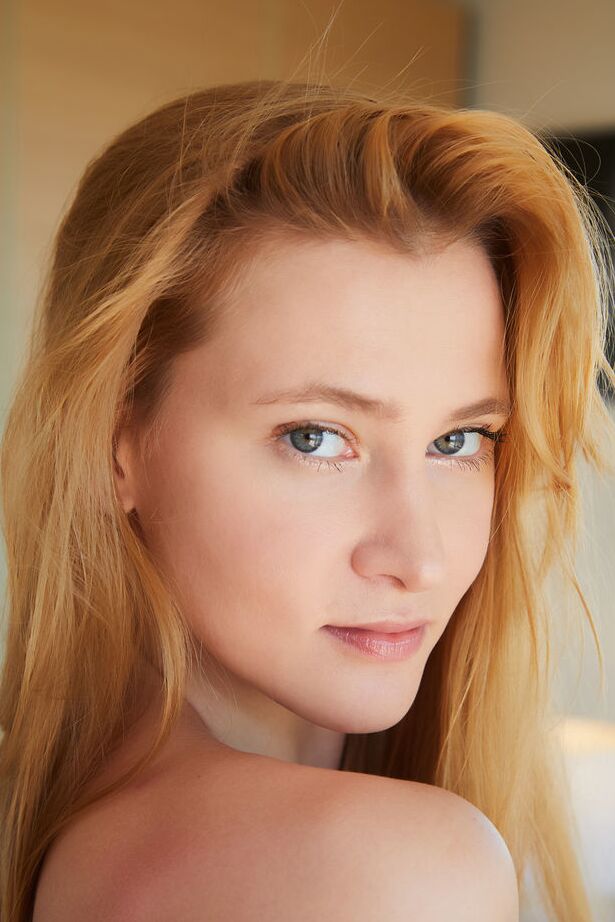 18P Young redhead Ivi Rein gets totally naked while in her bedroom