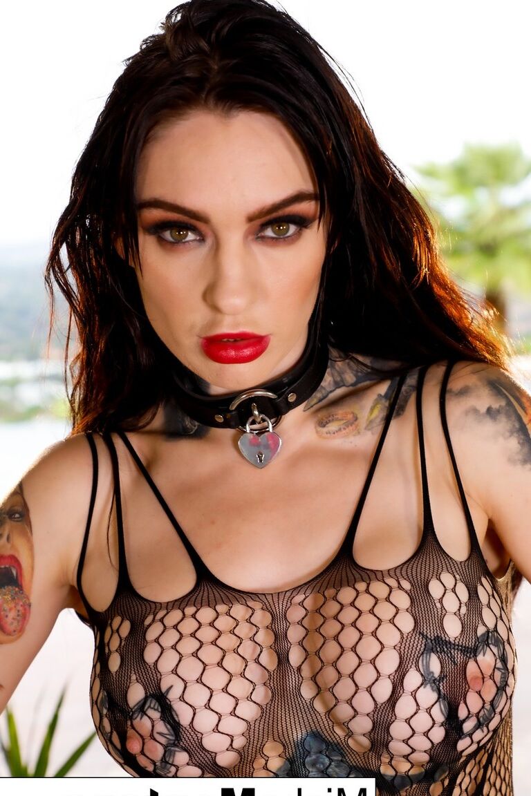 12P Collared and tattooed brunette Misha Montana dons a mesh bodystocking