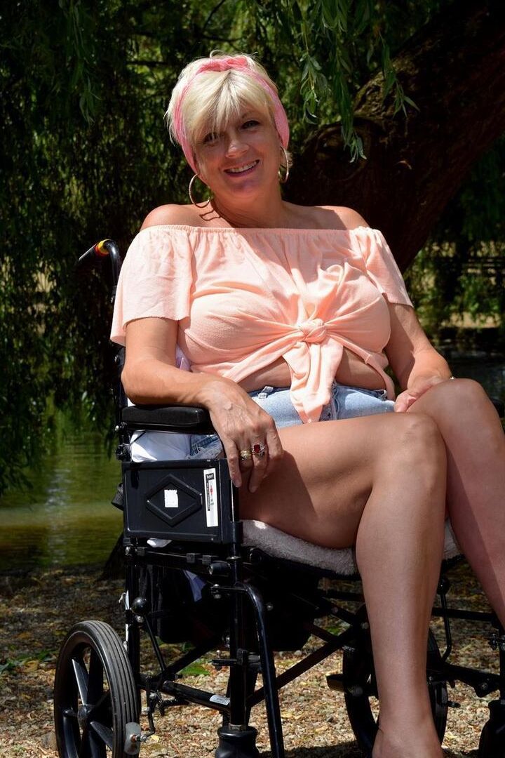 16P Mature blonde Dimonty gets totally naked while lounging on a chair in a yard