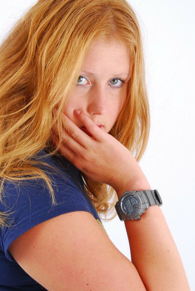 16P Natural redhead Judy displays her grey G-Shock watch in a T-shirt and jeans