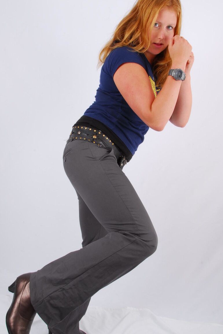 16P Natural redhead Judy displays her grey G-Shock watch in a T-shirt and jeans