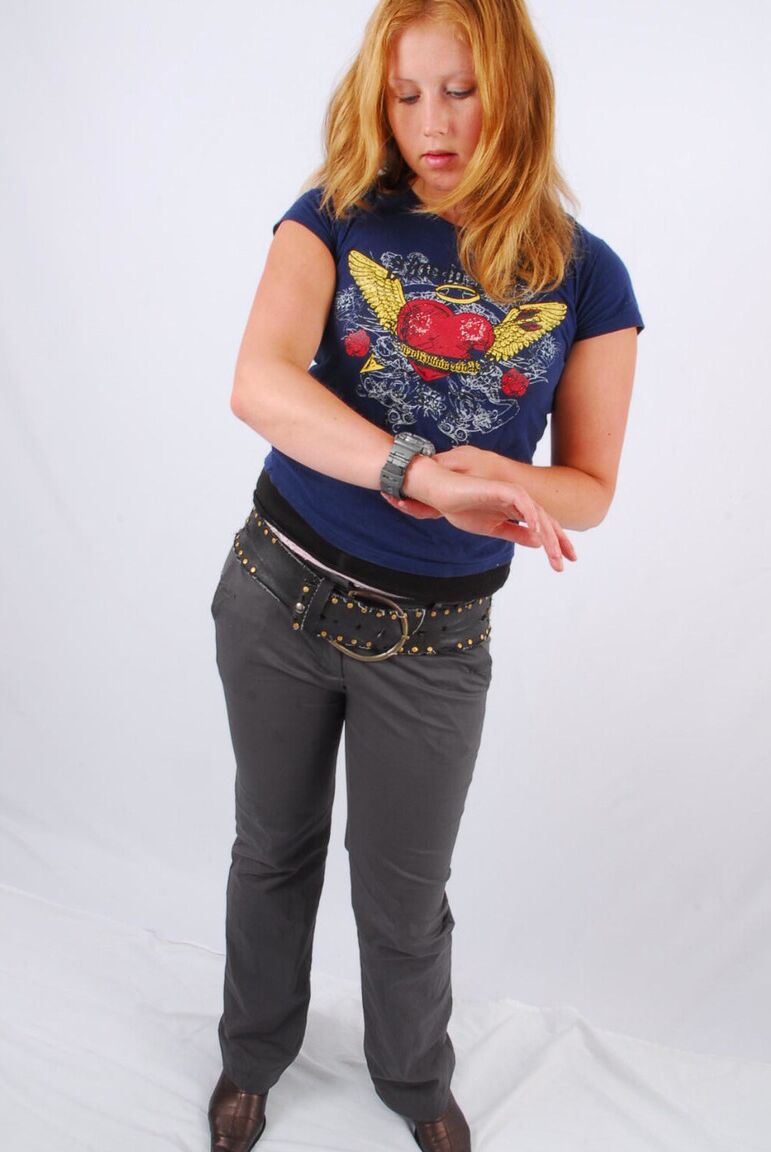16P Natural redhead Judy displays her grey G-Shock watch in a T-shirt and jeans