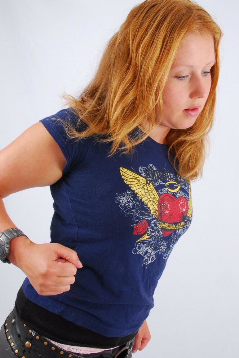 16P Natural redhead Judy displays her grey G-Shock watch in a T-shirt and jeans