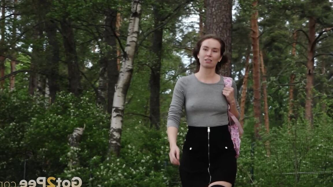 15P White girl takes a piss in the countryside while wearing over the knee socks